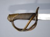 an image of a close up of a sword with a metal handle