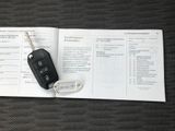 a car key sitting on top of a book on a table