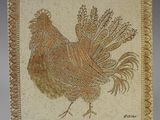 carreau décoratif représentant un coq couché sur le côté