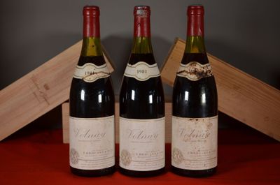 three bottles of wine sitting next to each other on a table