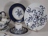 a lot of blue and white plates and cups and saucers