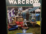the box of warcraw is sitting on a black surface