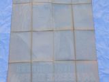 a close up of a sheet of paper on a blue sheet of paper