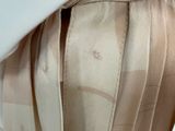a close up of a woman ' s dress with a label on it