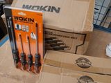 many boxes of tools sitting on a table in a room