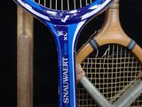 two tennis rackets sitting next to each other on a racket