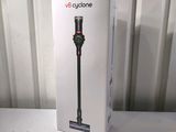 the box of the dysonon cyclone vacuum is open on the table