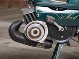a close up of a motorcycle parked in a garage