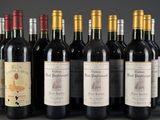 several bottles of wine are lined up on a table