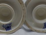 pair of blue and white porcelain vases on a white background