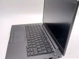 a laptop computer that is sitting on a white surface