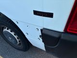a close up of a white van with a sticker on it