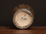 a close up of a bottle on a wooden table