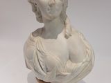 marble bust of a woman with braid hair on a wooden base