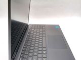 a laptop that is open on a white surface