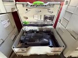 a suitcase that is open and sitting on the floor