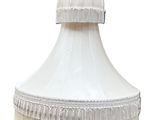 a white lamp that is hanging from the ceiling