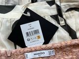 a close up of a pair of pants with tags on them