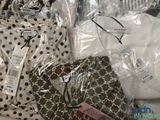 a pile of clothing that is sitting on a table
