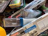 a pile of assorted electronics and electronics in a box