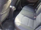 a red car with a black seat belt in the back of it