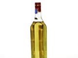a bottle of olive oil sitting on a white surface
