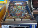 a pinball machine sitting on a table in a room
