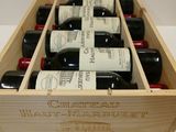 six bottles of wine in a wooden box