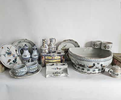 a white table with a lot of dishes and bowls on it