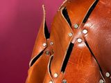 a close up of a brown leather jacket on a mannequin mannequin mannequin mannequin mannequin mannequin mannequin mann