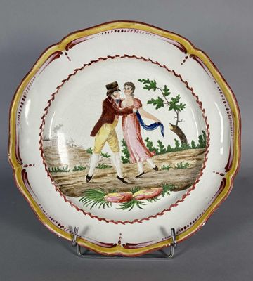une assiette avec la photo d'un homme et d'une femme