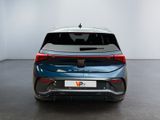 the rear end of a blue car in a white room