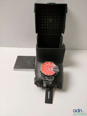 a clock on the back of a box on a table