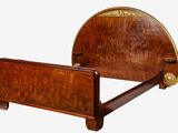 a bed with a wooden headboard and foot board