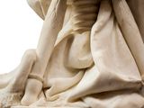 marble statue of a woman holding a vase on a pedestal