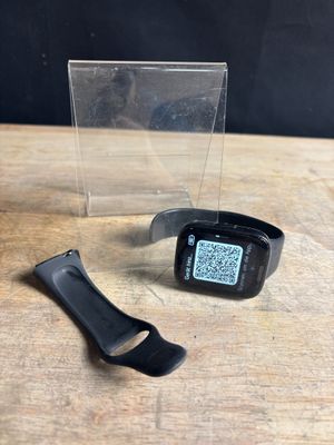 an image of a smart watch sitting on top of a wooden table