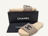 chanel jute slippers with black logo on the side