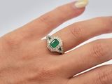 an image of a woman ' s hand with a ring on it