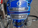 a close up of a blue motorcycle with a hose attached to it
