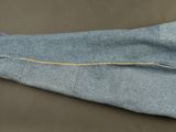 a pair of jeans with a zipper on the side