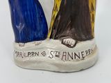 an image of a ceramic figurine of a man and a woman