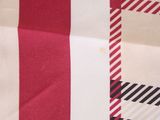 a close up of a red and white checkered table cloth