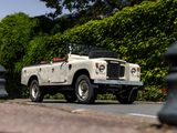 a white land rover parked on the side of the road