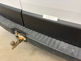 a close up of a car with a tow bar attached to it ' s bumper