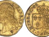 a gold sovereign coin with a crown on top of it