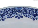 a blue and white plate with a floral design on it