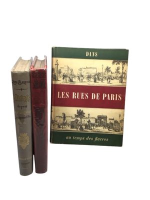 two books sitting next to each other on a white surface