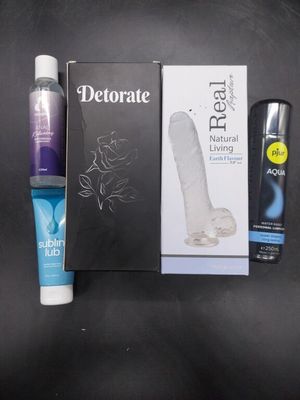 a toothbrush, toothpaste, toothpaste and a tube of toothpaste next to a box of toothpaste