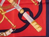 banda with a picture of a bunch of knives and chains on a red and blue background
