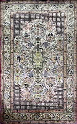 an antique persian rug with a floral design